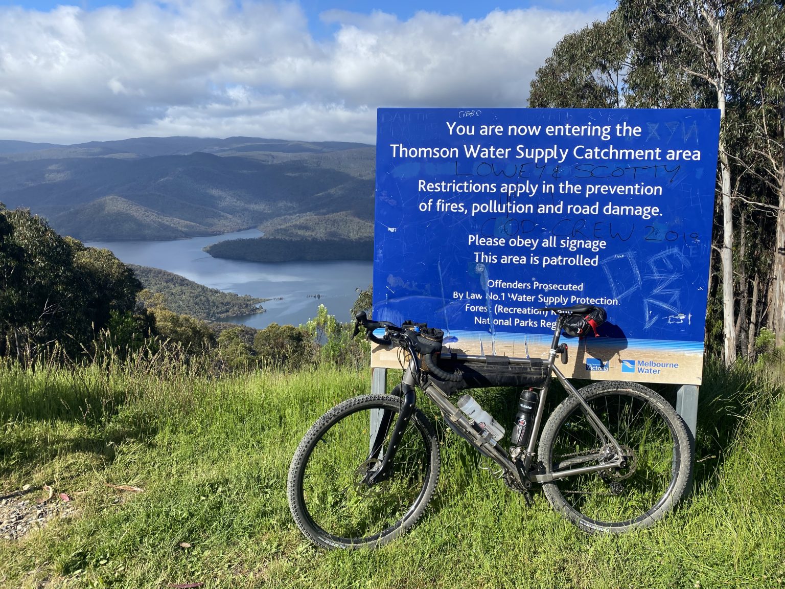An Auren titanium bike at a lookout above a reservoir
