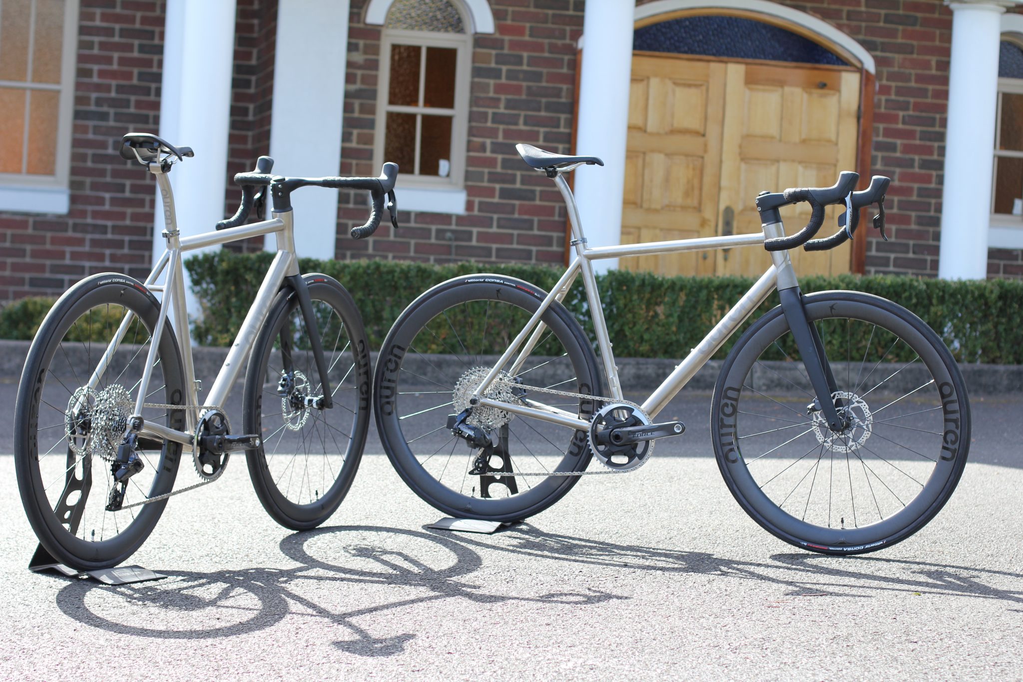 Two Auren titanium all-road bikes in the afternoon sun