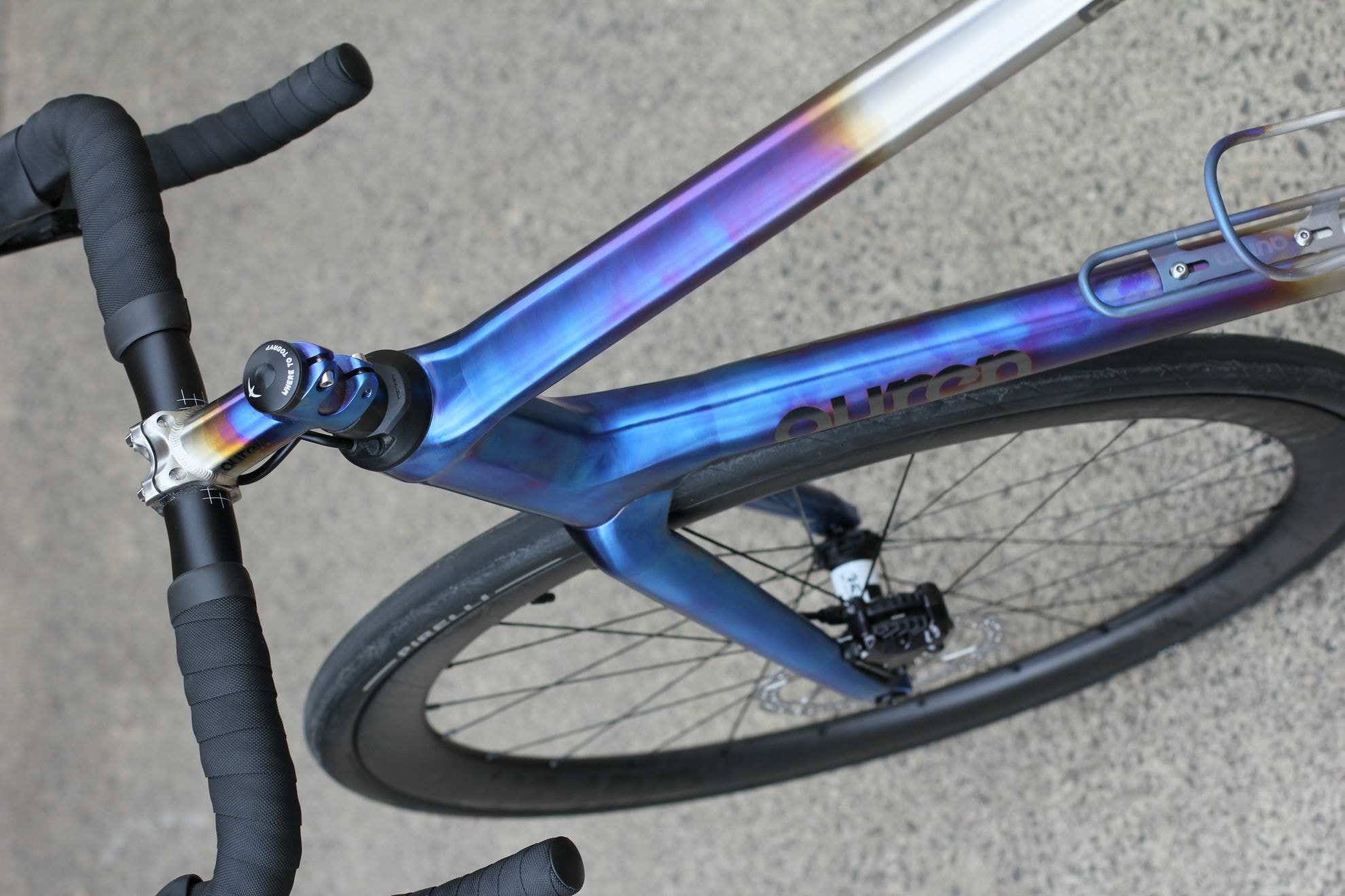 Looking down the front of an Auren anodised titanium road bike with 3D-printed details