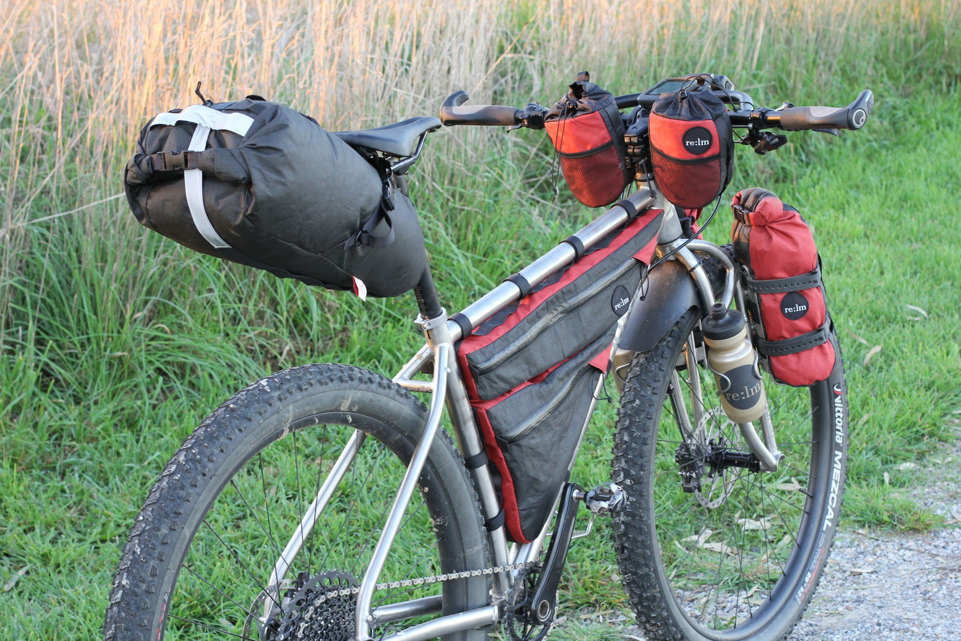 Auren titanium bike loaded with a seat pack, frame bag and fork bags