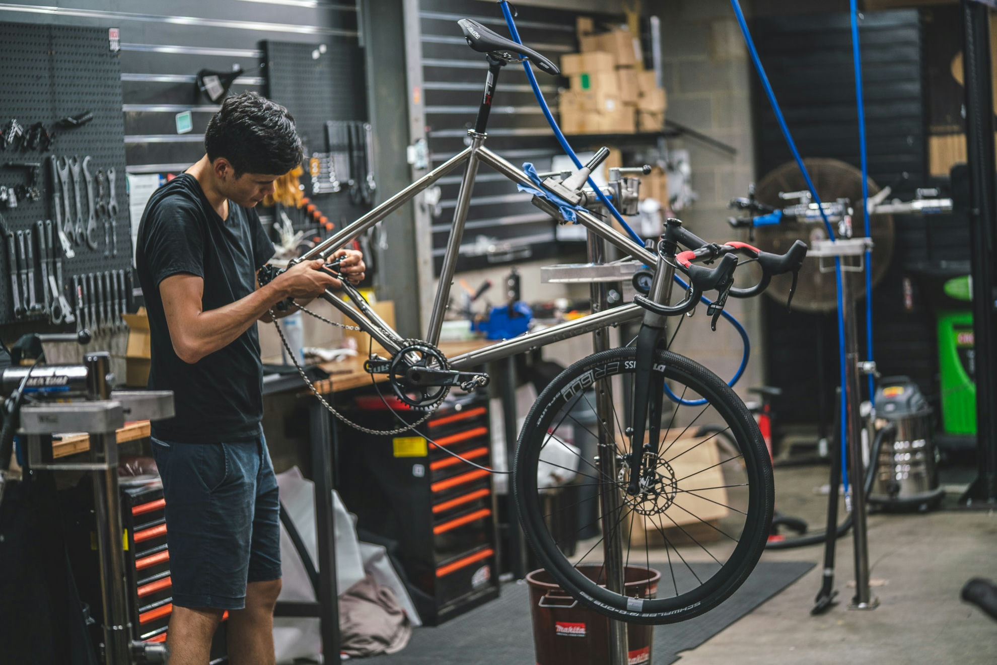 Will fitting components to a titanium frame in the workshop stand