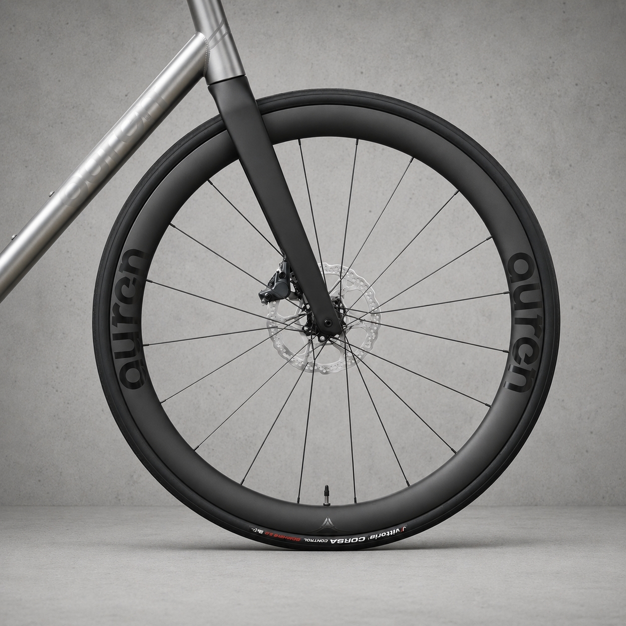 Carbon fork and front wheel on an Auren titanium road bike